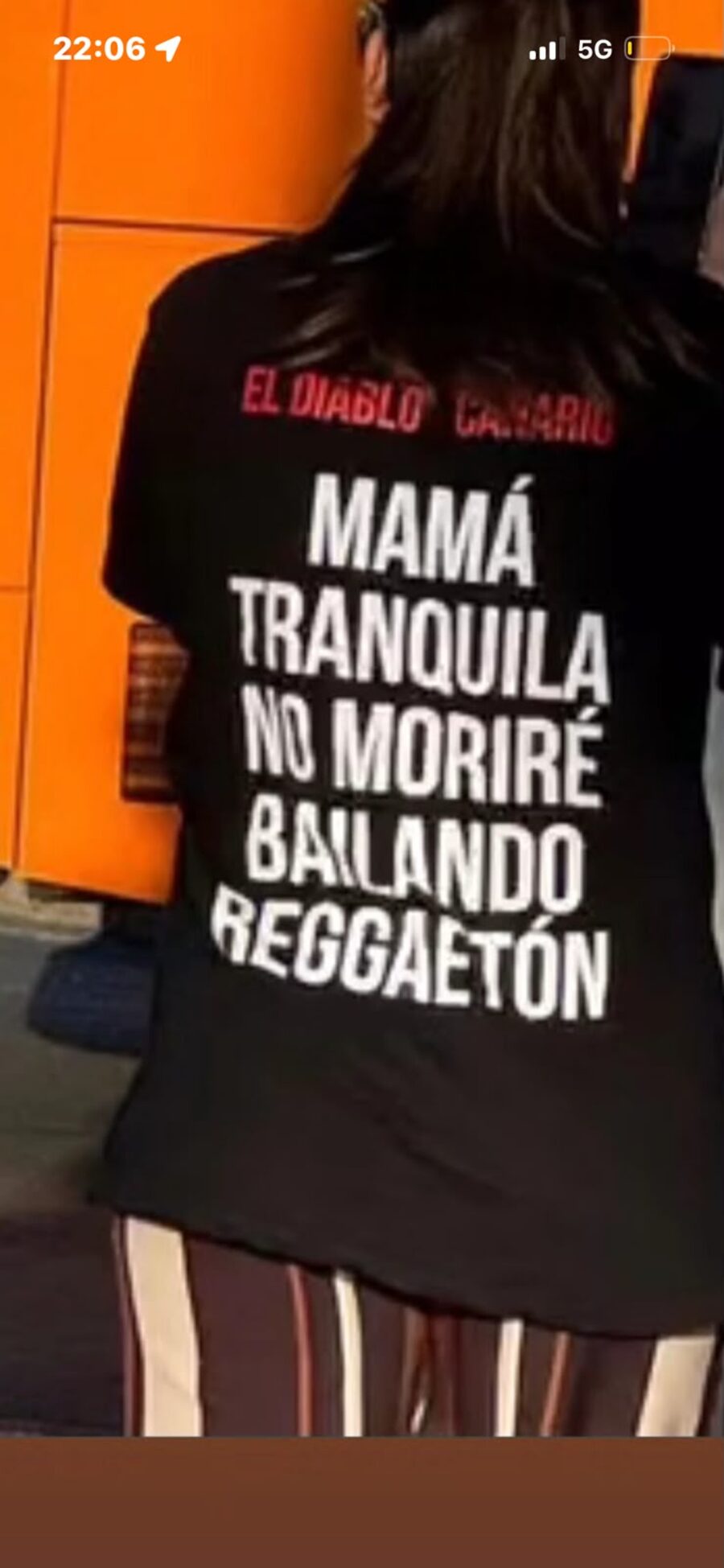 Fan wearing El Diablo Canario apparel at a rave