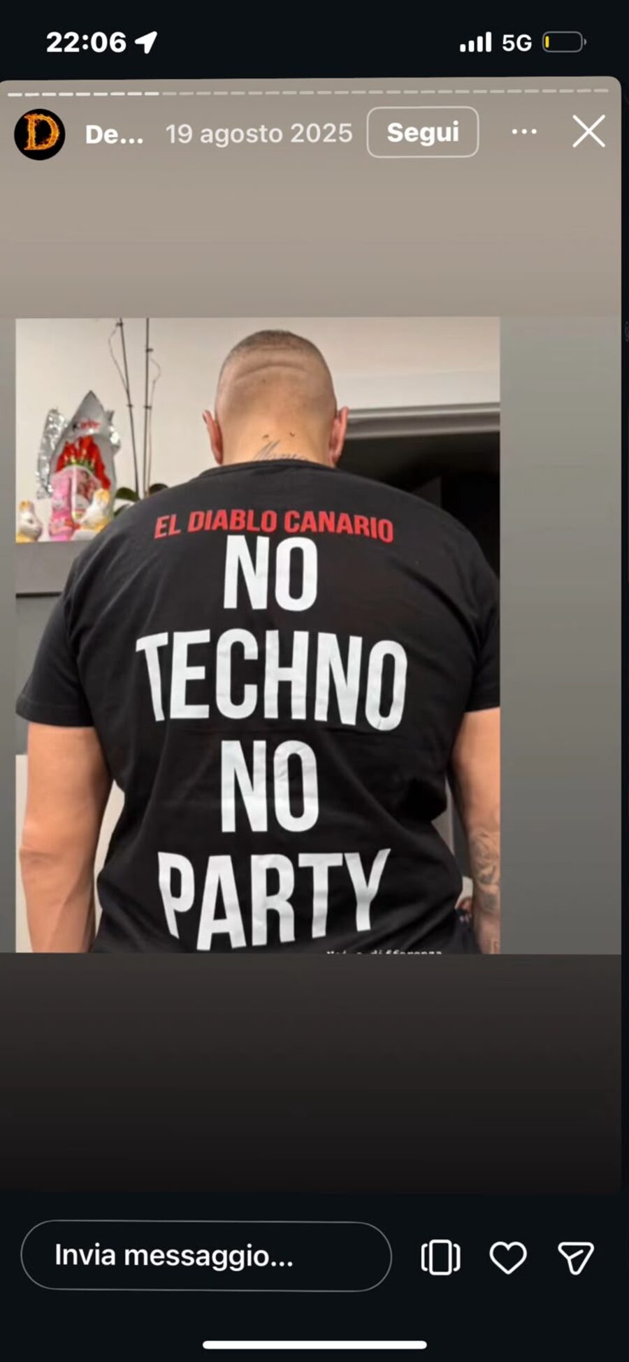 Fan in El Diablo Canario streetwear at night in Ibiza